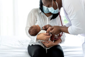 African,Doctor,Wearing,Surgical,Mans,And,Using,A,Stethoscope,,Checking