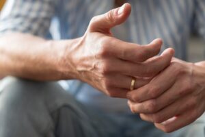 close-up-hands-with-golden-ring_23-2148558394